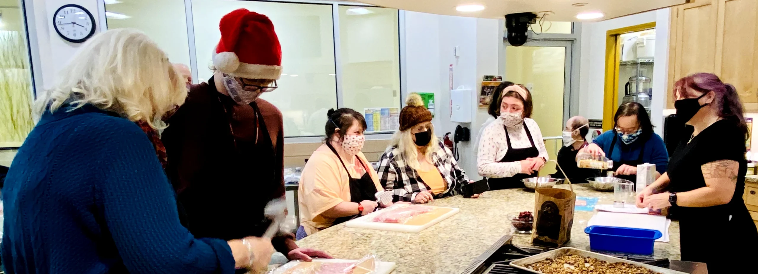 Group of adults that are making some food