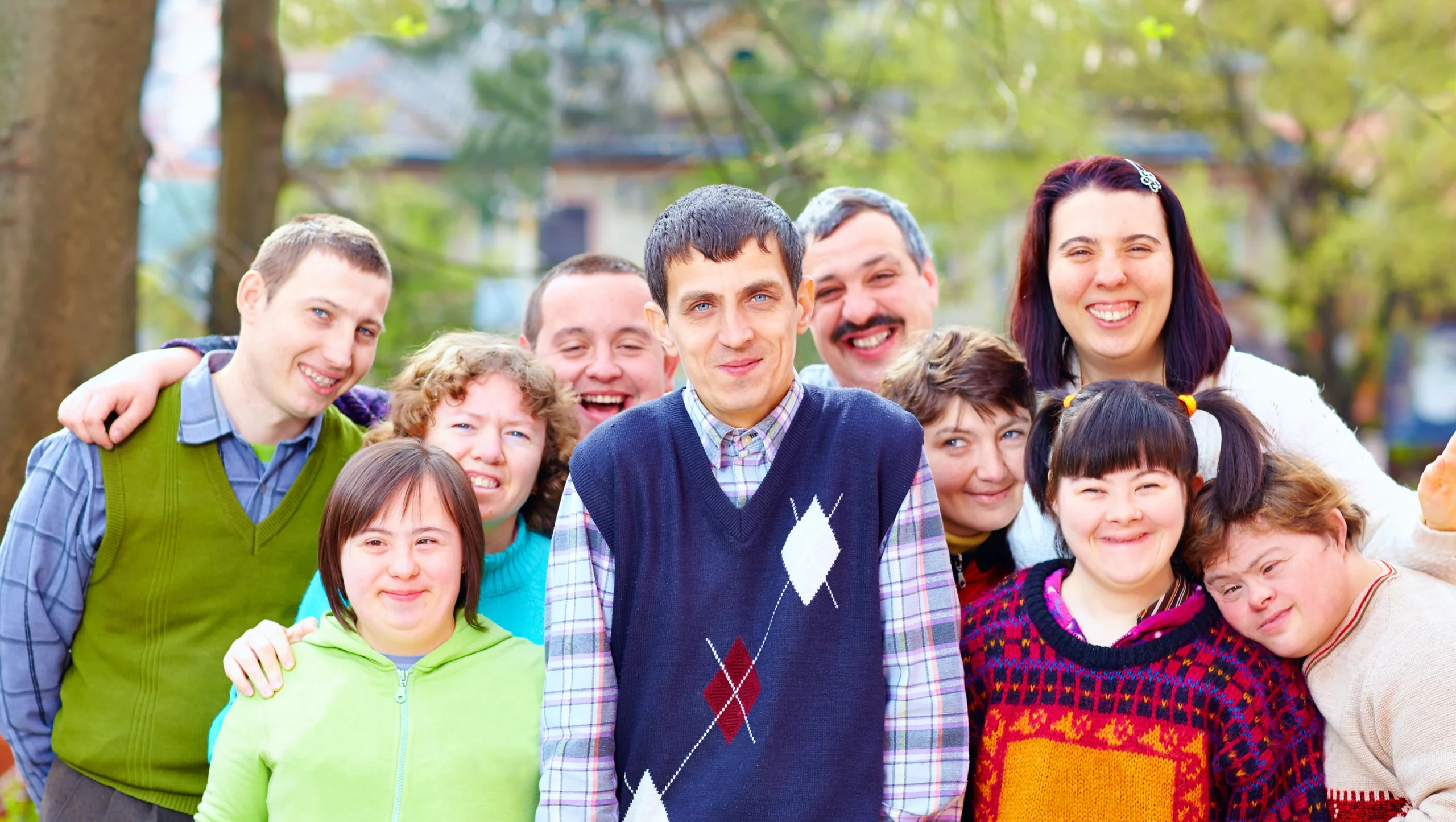 group of happy people with disabilities new